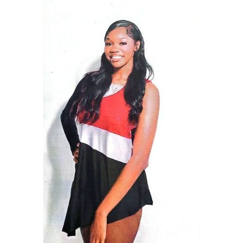 Smiling woman in red, white, black dress