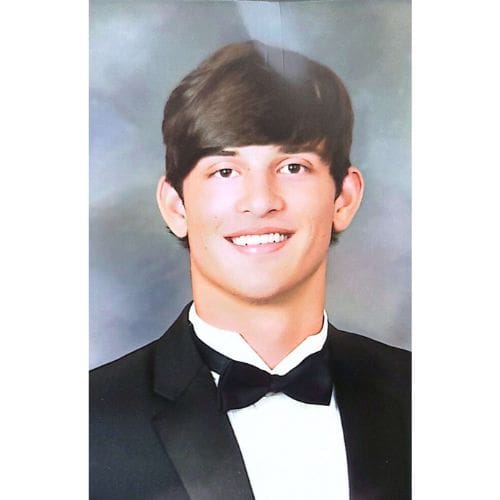 Smiling young man wearing a tuxedo portrait