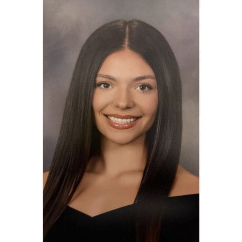 Smiling young woman portrait with long straight hair