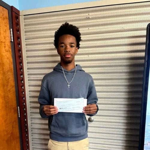 Person holding a check