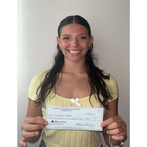 Smiling woman holding a check