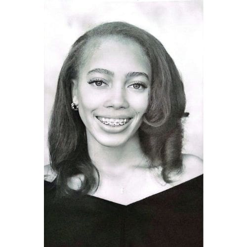 Smiling young woman with braces portrait